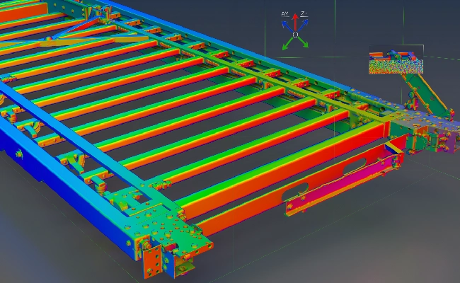 3D CAD model of a large steel frame with parallel beams, color-coded for stress from blue to red, viewed from above with axis indicator in corner