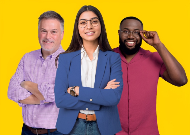 Three professionals standing against a bright yellow background, arms crossed and smiling confidently.