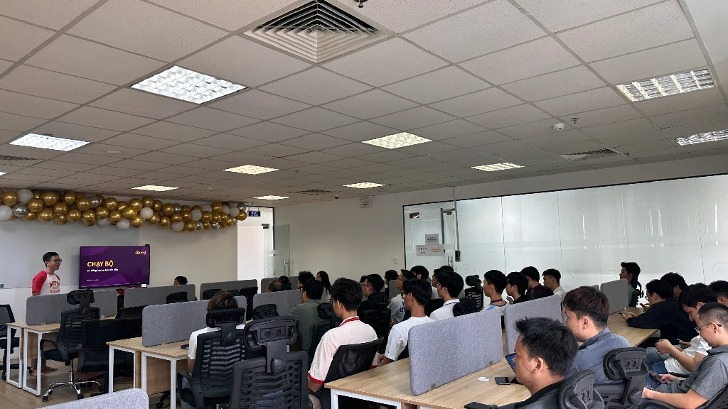 Employees listening to a presenter in the office