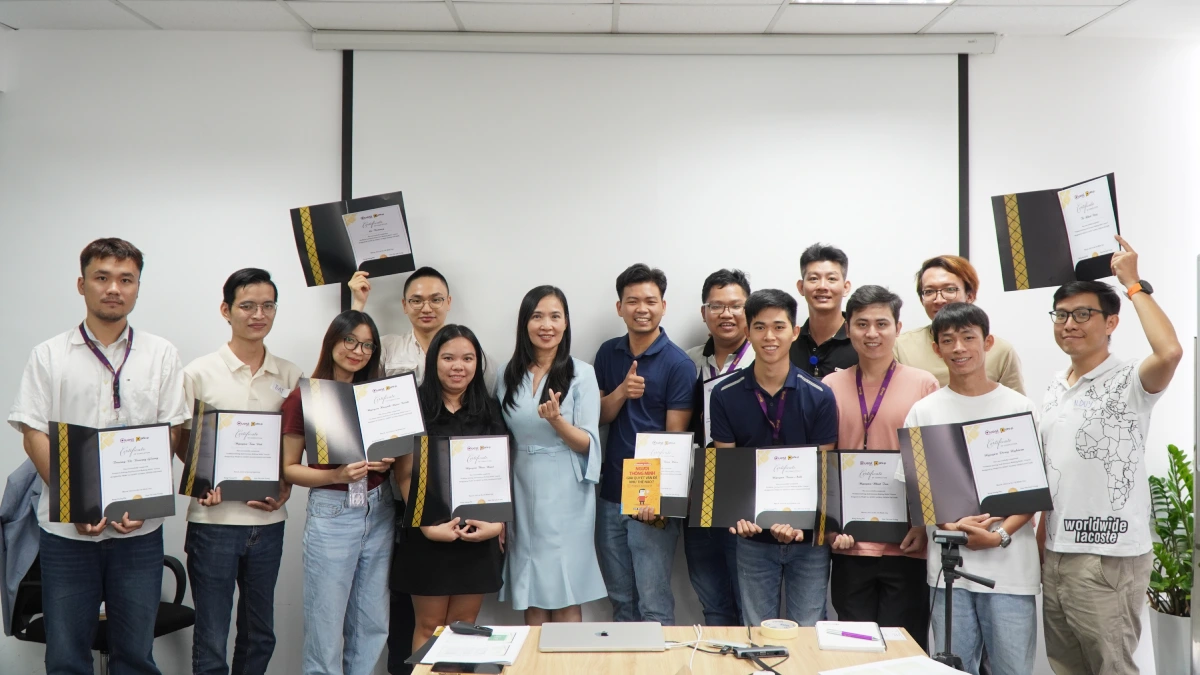 Team members holding their certificates