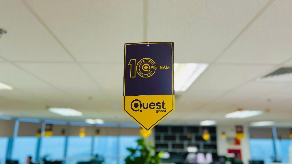 Close-up of hanging Quest Global anniversary decorations