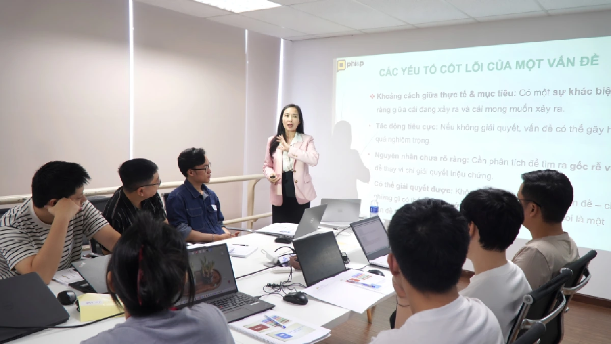 Team attending a presentation in a meeting room