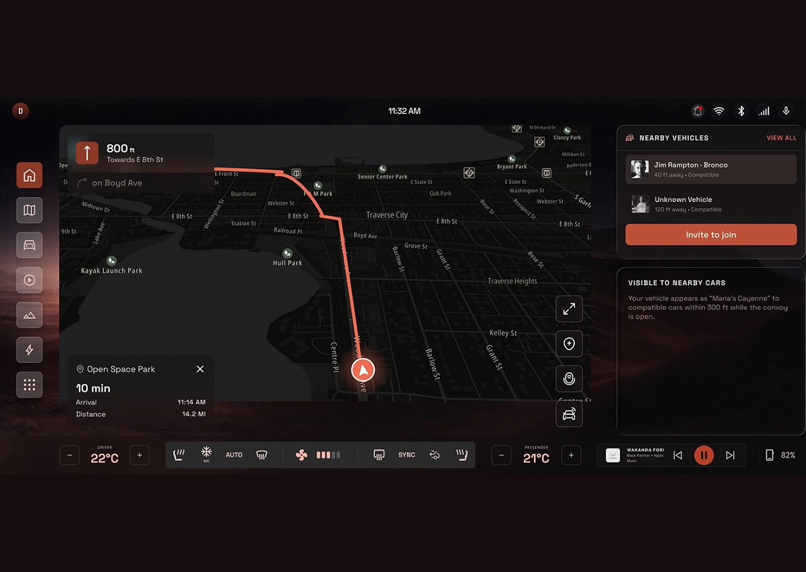 Dark in-car navigation screen showing a map with a red route and current vehicle icon near center-left, time 11:32 AM, side panels with nearby vehicles and actions.